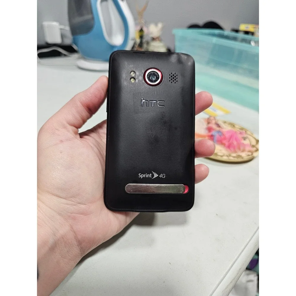 vintage HTC Evo 4G smartphone for the Sprint network stand y2k
